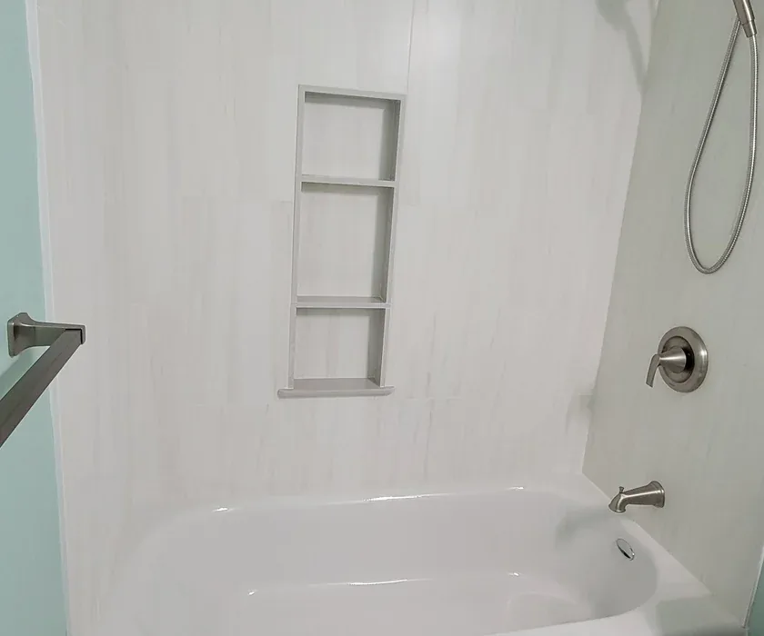 Remodeled bathroom with tiled walk-in shower and glass enclosure in a Charlotte, NC home