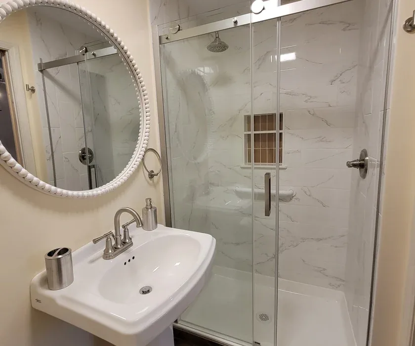 Guest bathroom remodel with ceramic tile floor, vanity and stone countertop