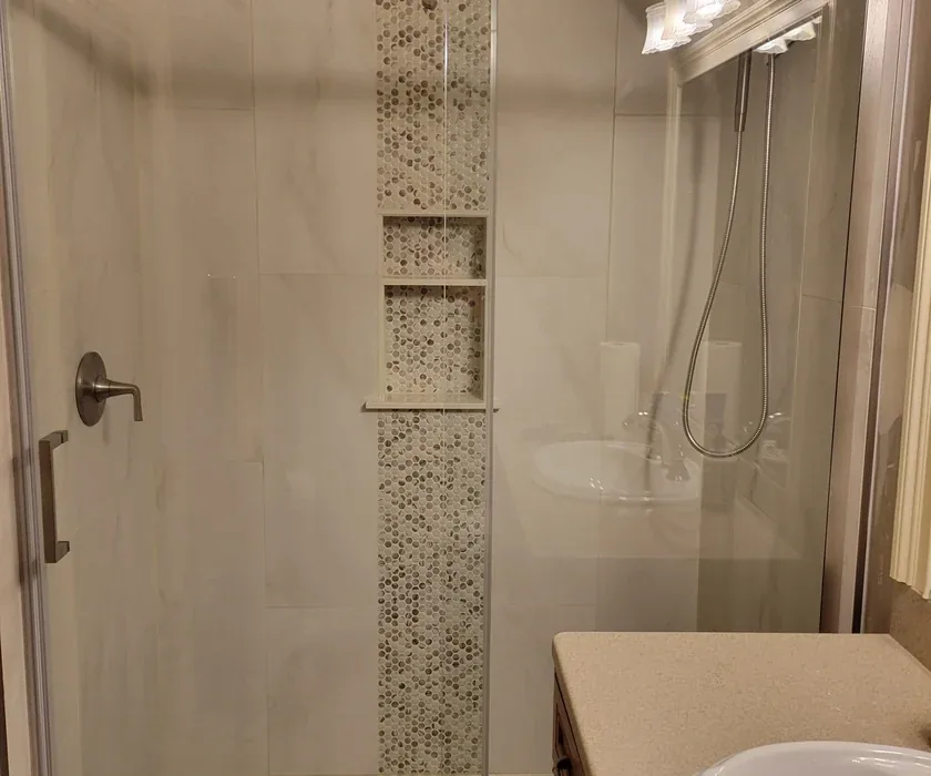 Guest bathroom remodel with ceramic tile floor, vanity and stone countertop