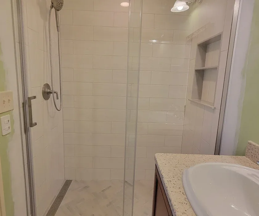 Remodeled bathroom with tiled walk-in shower and glass enclosure in a Charlotte, NC home