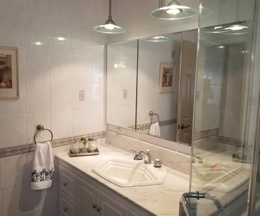 Guest bathroom remodel with ceramic tile floor, vanity and stone countertop
