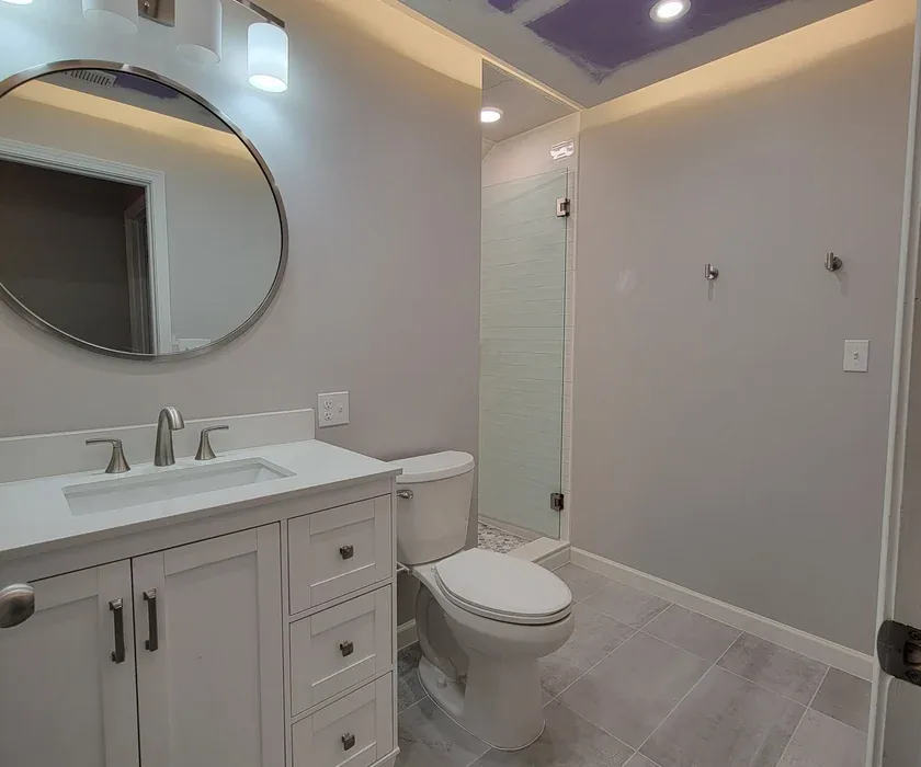 Guest bathroom remodel with ceramic tile floor, vanity and stone countertop